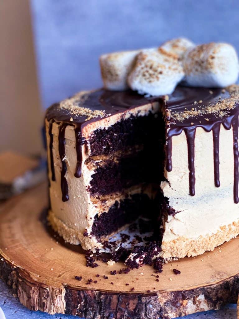 S'mores peanut butter cake with a slice missing