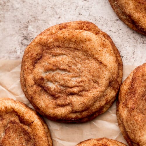 Brown butter snickerdoodle cookies on parchment paper.