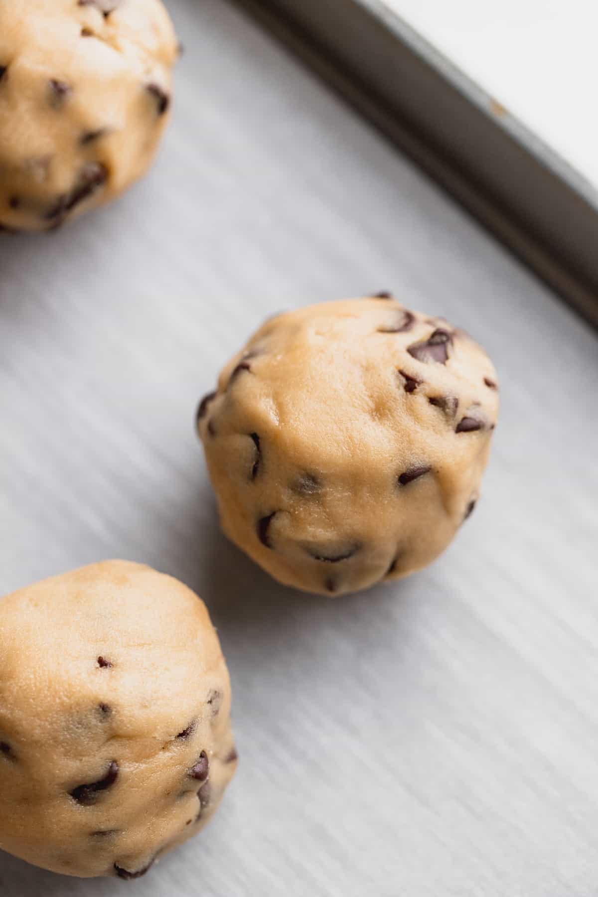 Rolled cookie dough on a cookie sheet.