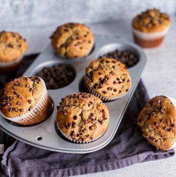 Chocolate peanut butter banana muffins sitting in the muffin tin.