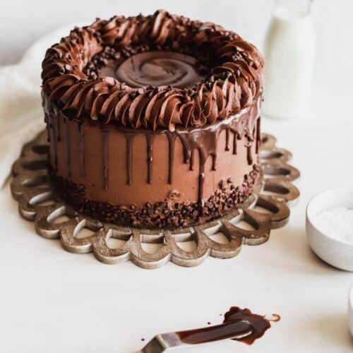 Moist Triple chocolate cake covered in chocolate drip.