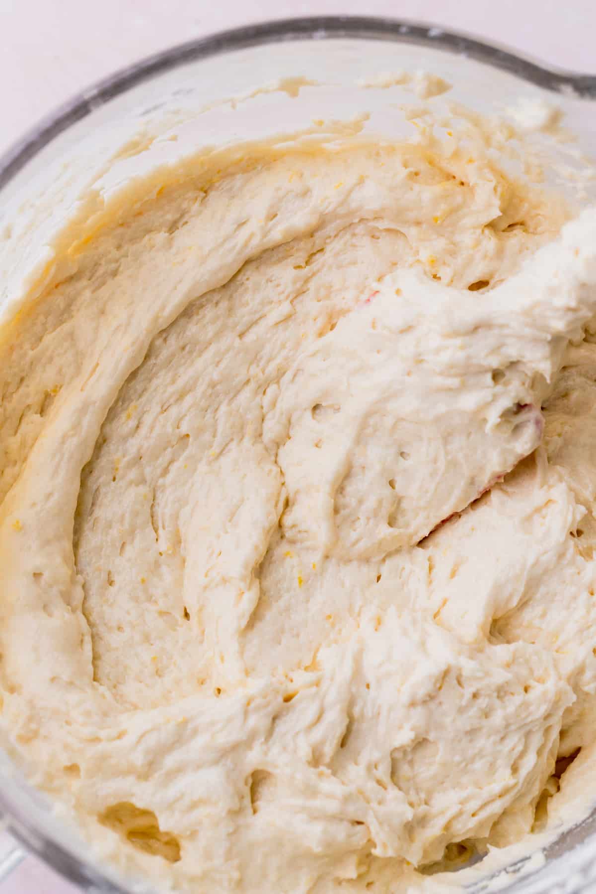 Lemon cake batter in a glass bowl.