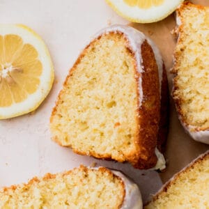 Lemon bundt cake slices on parchment paper.