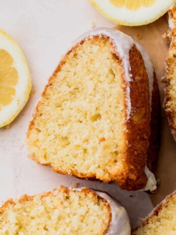 Lemon bundt cake slices on parchment paper.