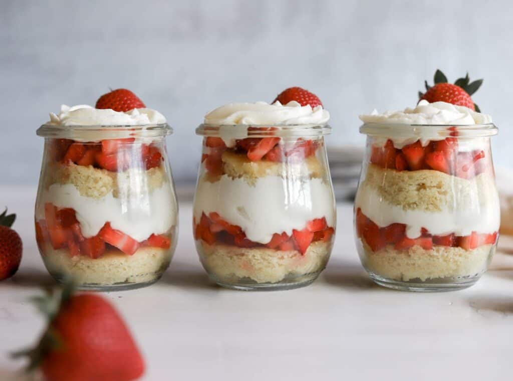 Easy Strawberry shortcake trifles in 3 jars with whipped cream cheese.