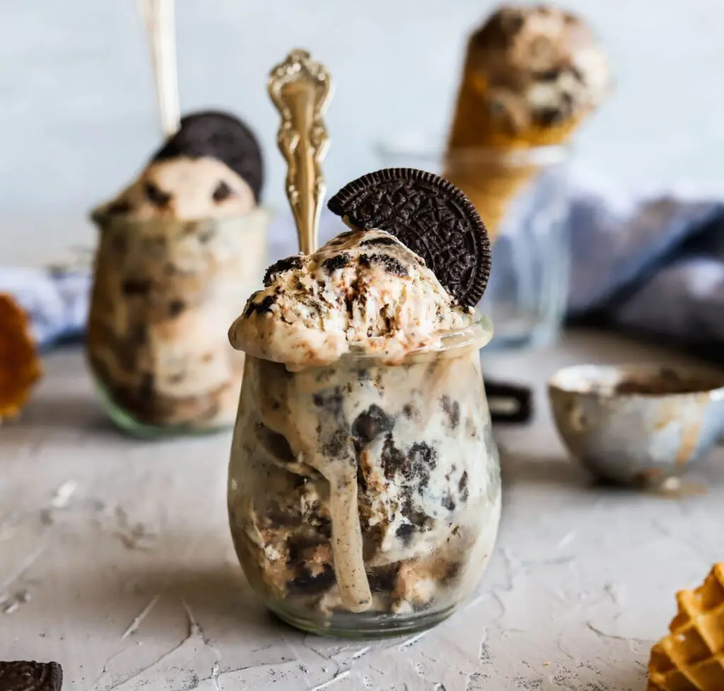 A jar of no-churn oreo and hot fudge ice cream that is easy to make with no machine.