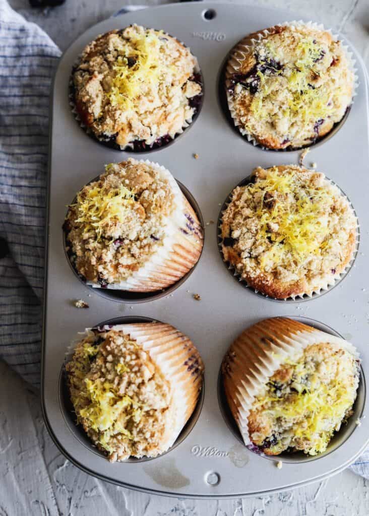 6 lemon blueberry muffins in a jumbo muffin tin.