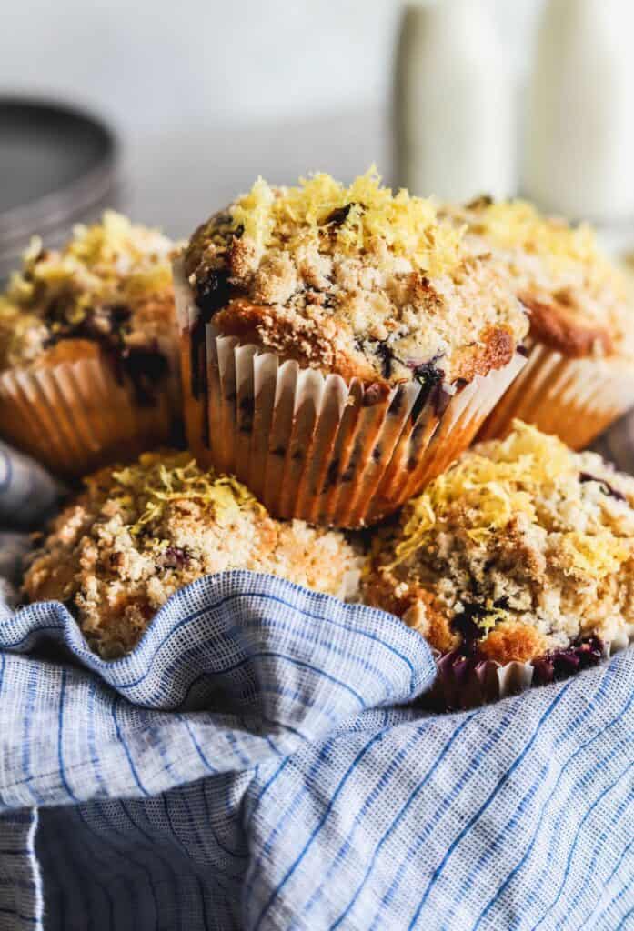 Easy lemon blueberry muffins in a bowl with a napkin.