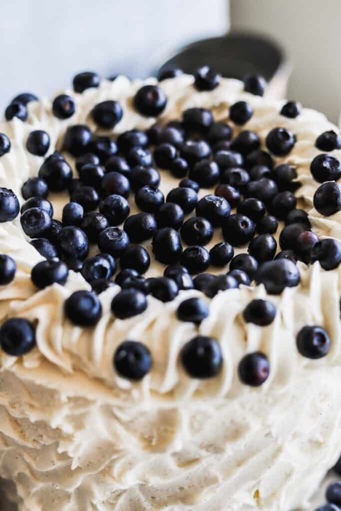 The top of the blueberry jam and cream cake showing off all the fresh blueberries.