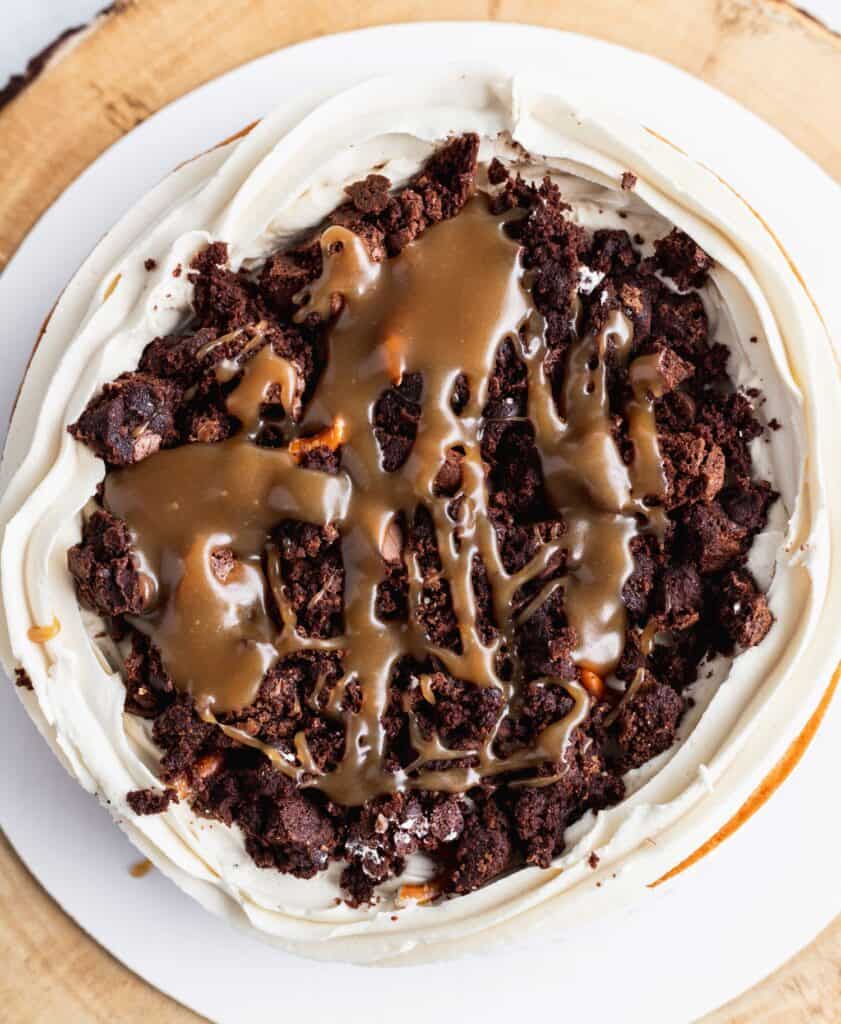 Fudgy brownie filling with butterscotch sauce on top of a cake layer.