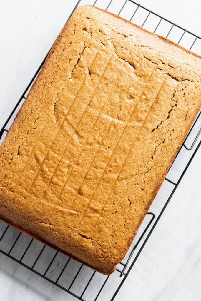 Spice sheet cake on a cooling rack.