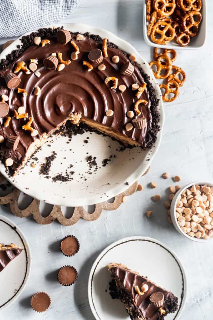 Chocolate peanut butter cup pie with slices missing from the pie dish.