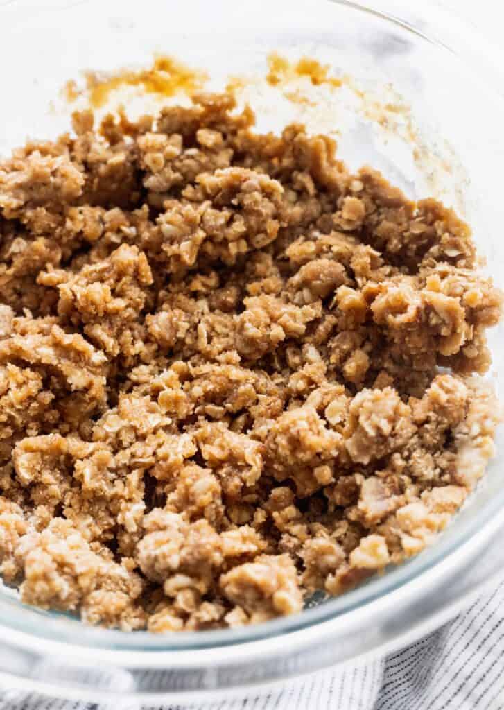 Cinnamon oat streusel in a glass mixing bowl.