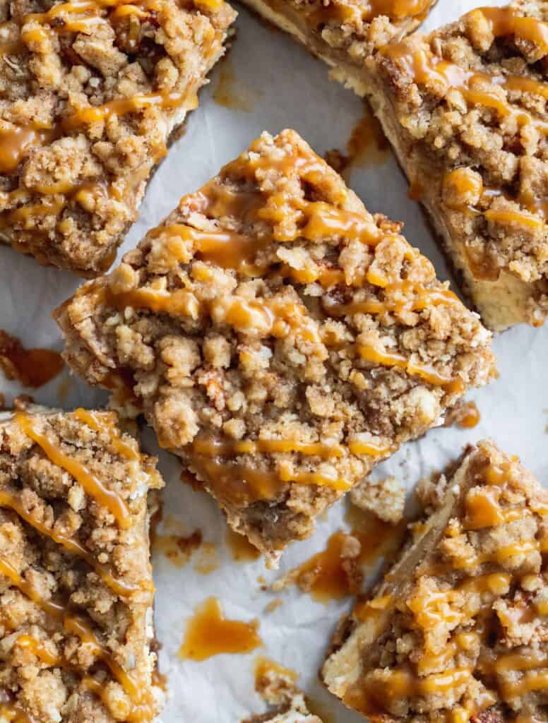 Close up shot of the top of a caramel apple cheesecake bars.