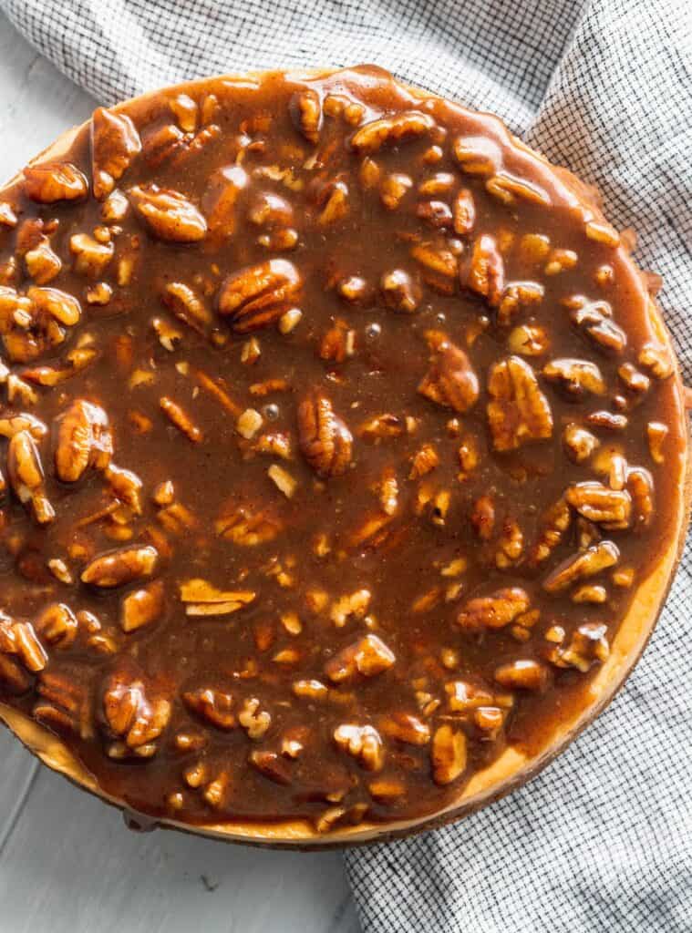 Pecan topping on top of brown sugar cheesecake