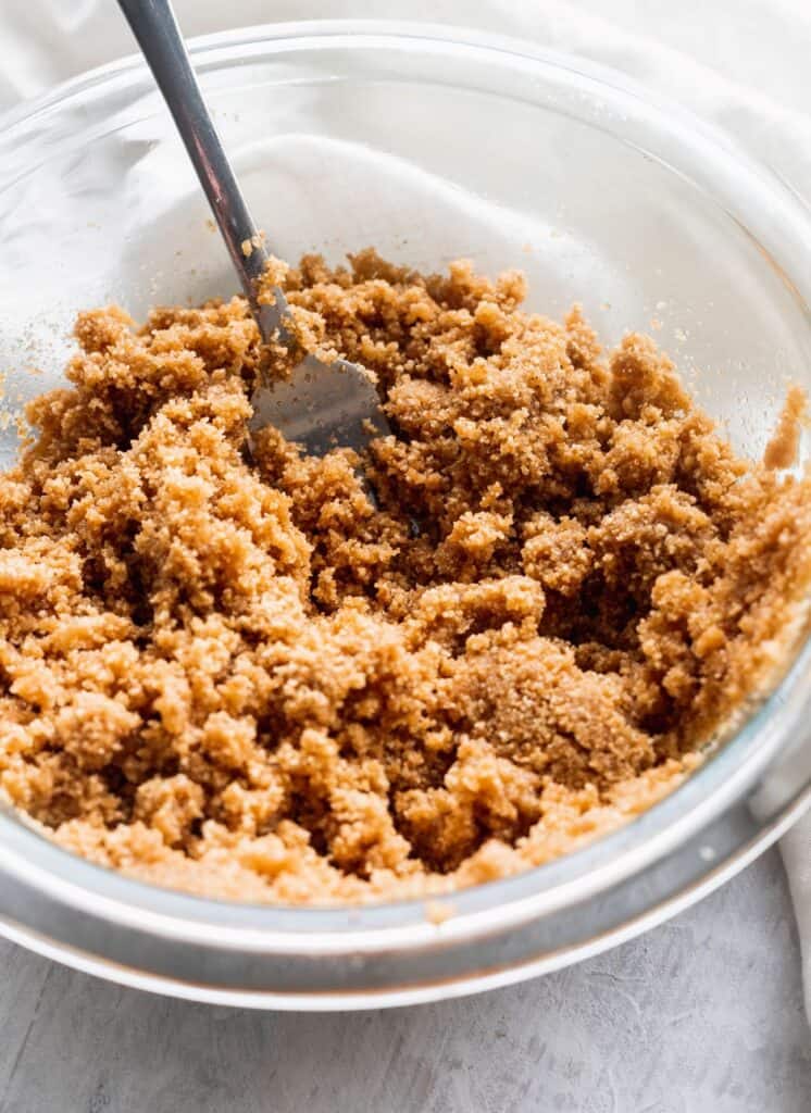 Graham cracker crumbs in a glass bowl.
