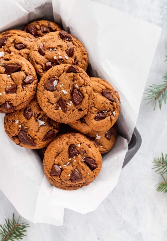 Chocolate gingerbread cookies in a tin.