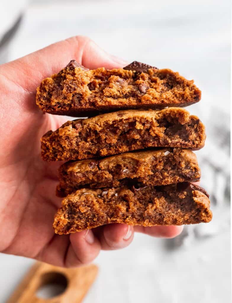 A stack of chocolate gingerbread cookies showing the chewy center.