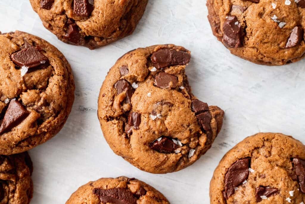 Chewy cookies with a bite missing.