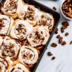 Walnut cinnamon rolls with sweet maple nuts on top.