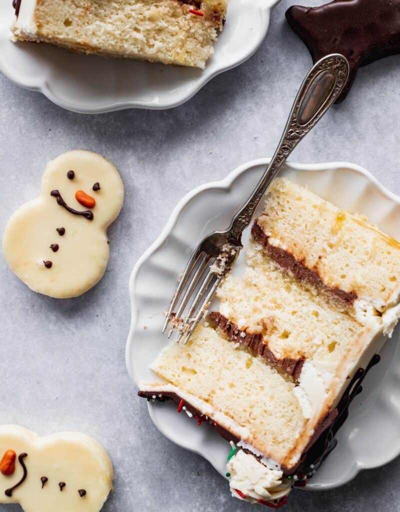 1 slice of cake with little snowman on the side
