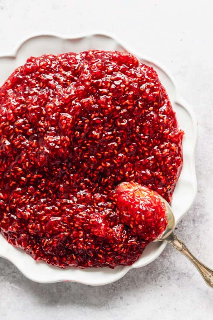 Homemade raspberry jam on a plate.