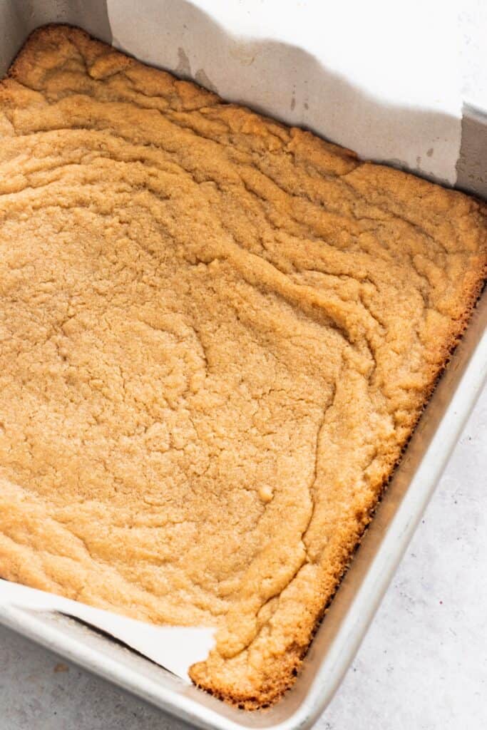 peanut butter cookie crust in a pan.