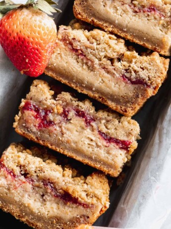 Close up of peanut butter and jelly cheesecake bars