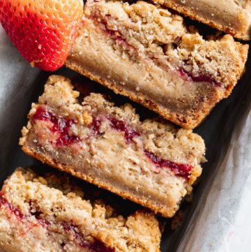 Close up of peanut butter and jelly cheesecake bars