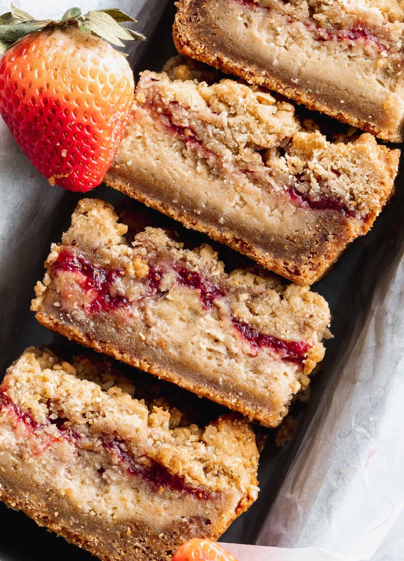 Close up of peanut butter and jelly cheesecake bars