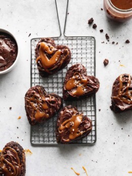 Heart shaped brownies on a wire grate.
