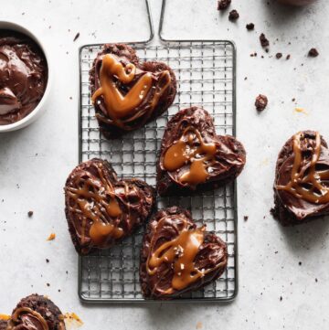 Heart shaped brownies on a wire grate.