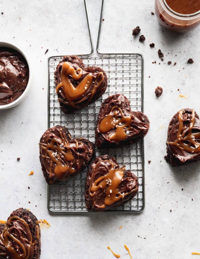 Heart shaped brownies on a wire grate.