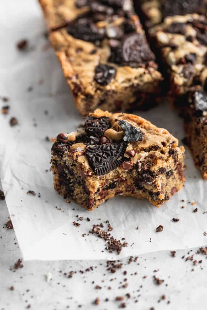 Oreo blondies with a bite missing.