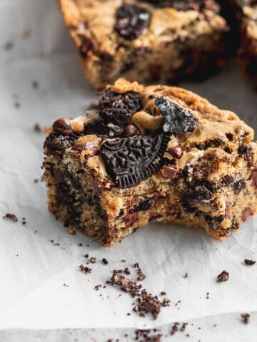 Oreo blondies with a bite missing.