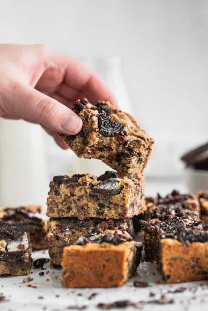 Lifting an Oreo blondie off the stack.