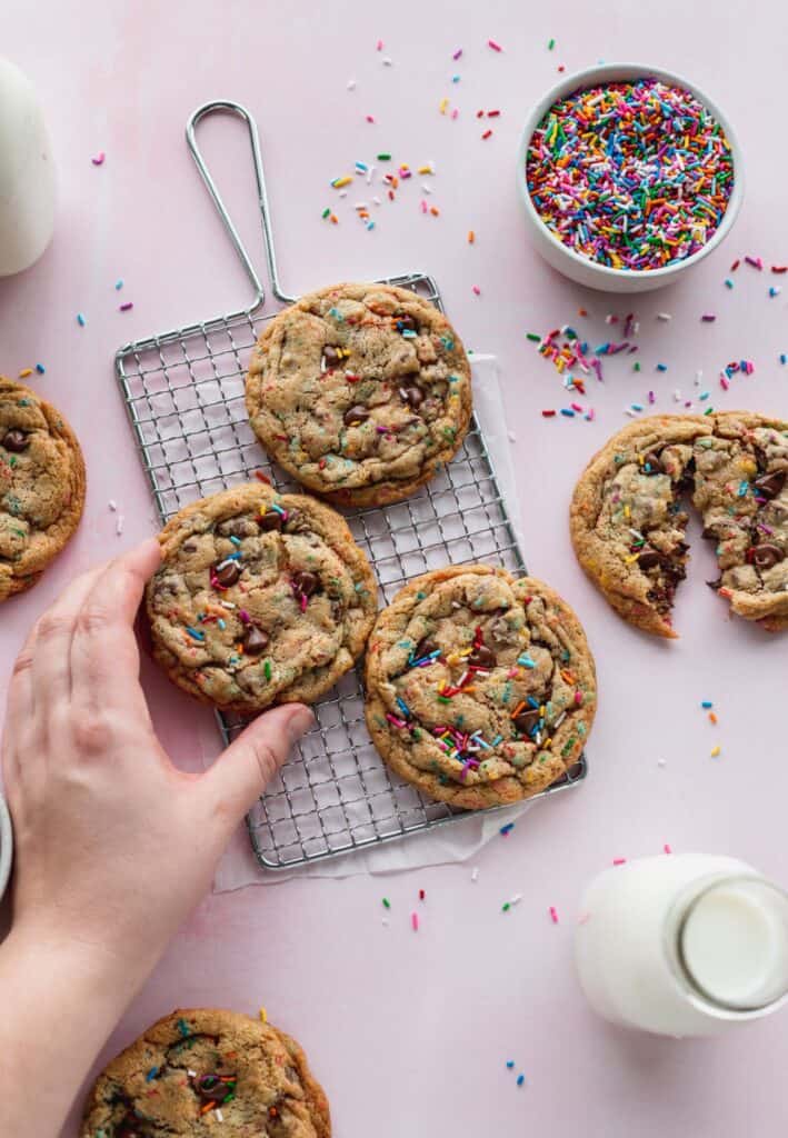 Sprinkle chocolate chip cookies on a wire rack.