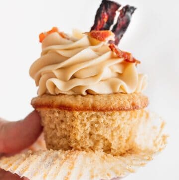 Holding a maple bacon cupcake.