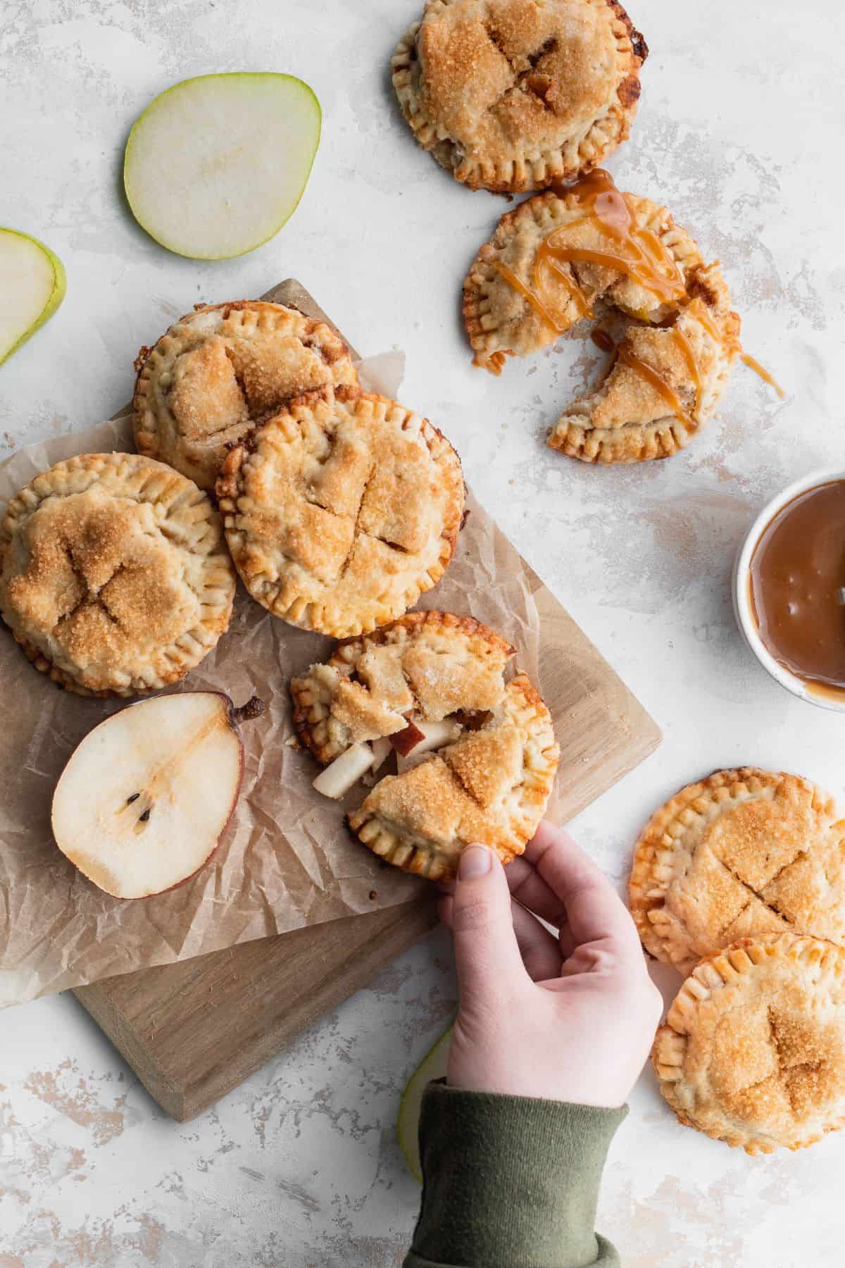 Butterscotch pear turnovers on a cutting board.