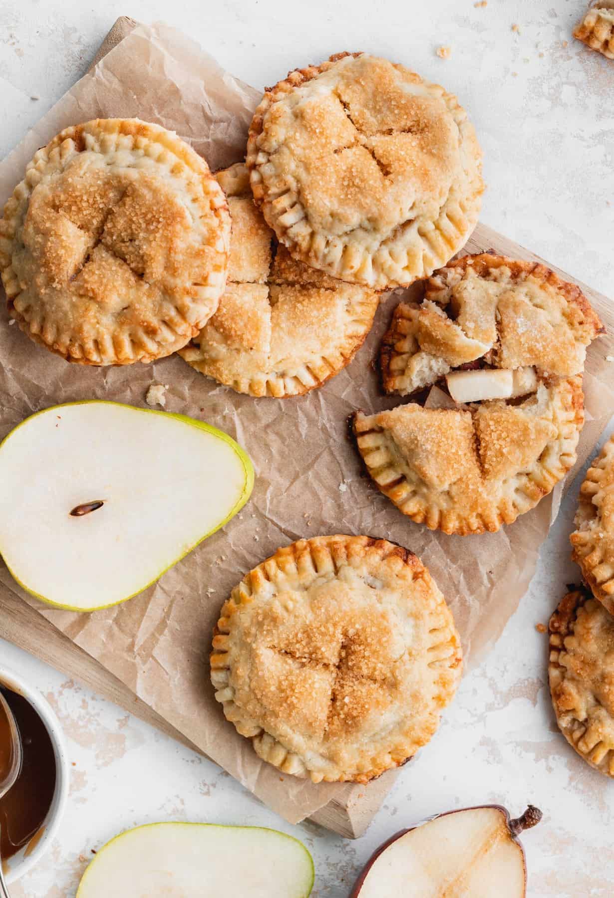 Pies on a cutting board.