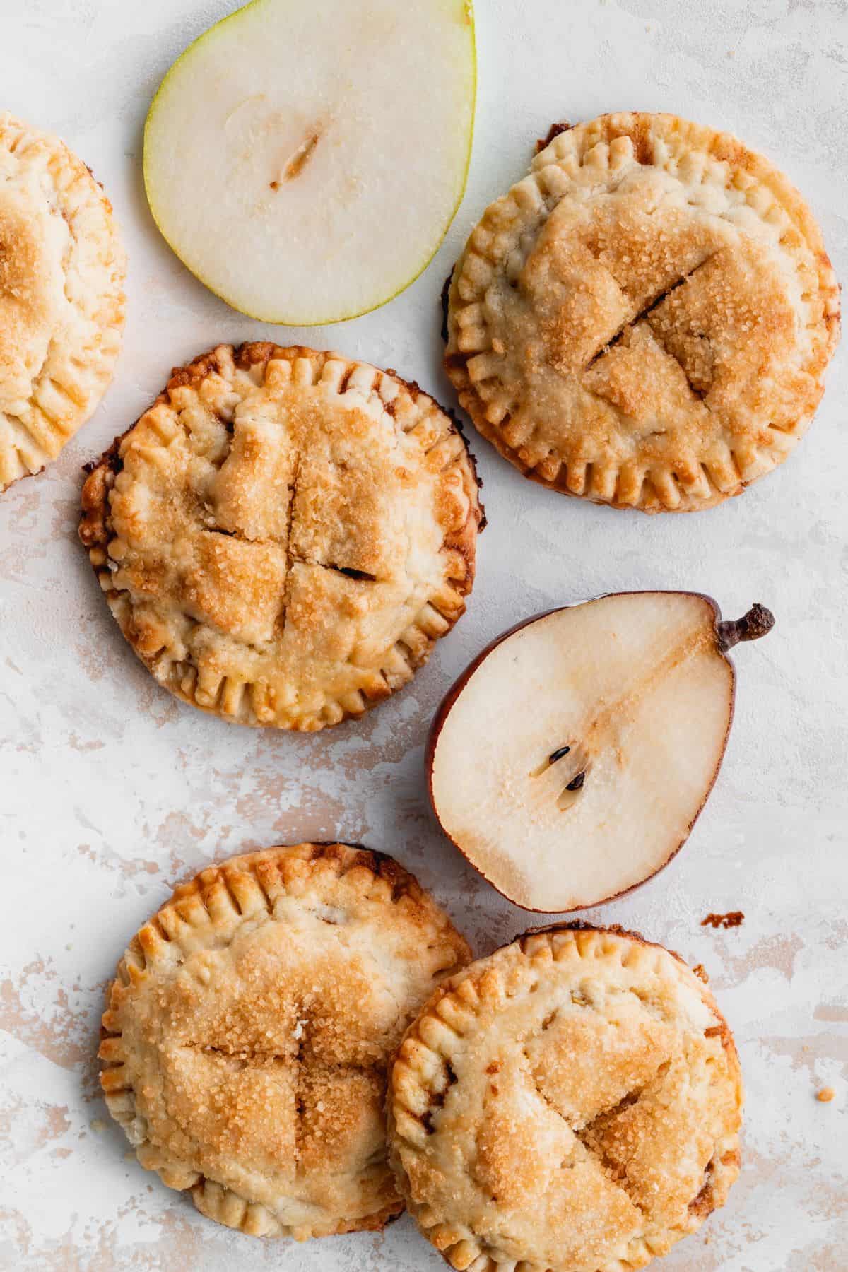 Butterscotch pear turnovers with pear halves.