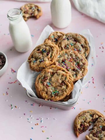 Sprinkle chocolate chip cookies in a tin.