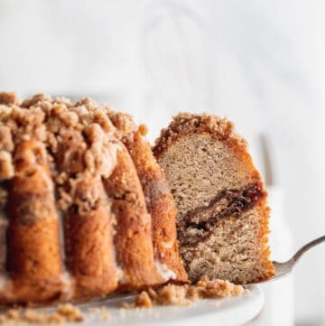 Pulling a slice from banana bread coffee cake.