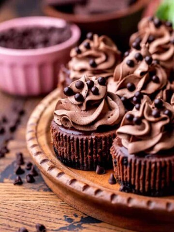 Side view of mini chocolate cheesecakes.