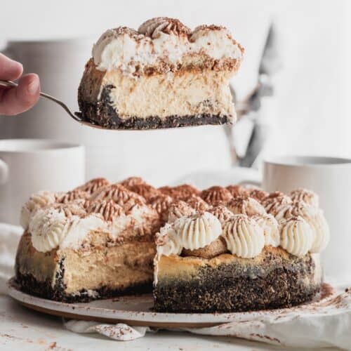 Cheesecake slice being taken out.