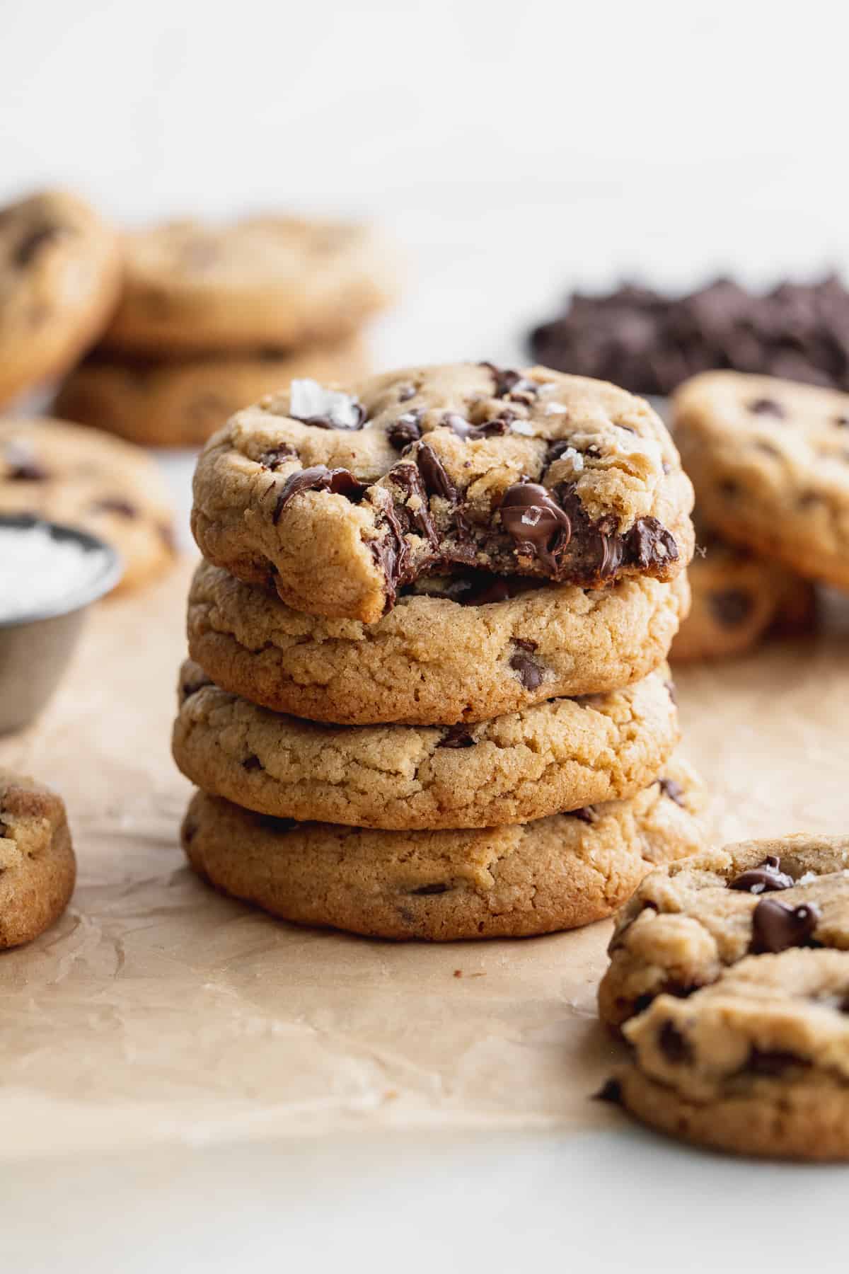 Stack of cookies with 1 missing a bite.