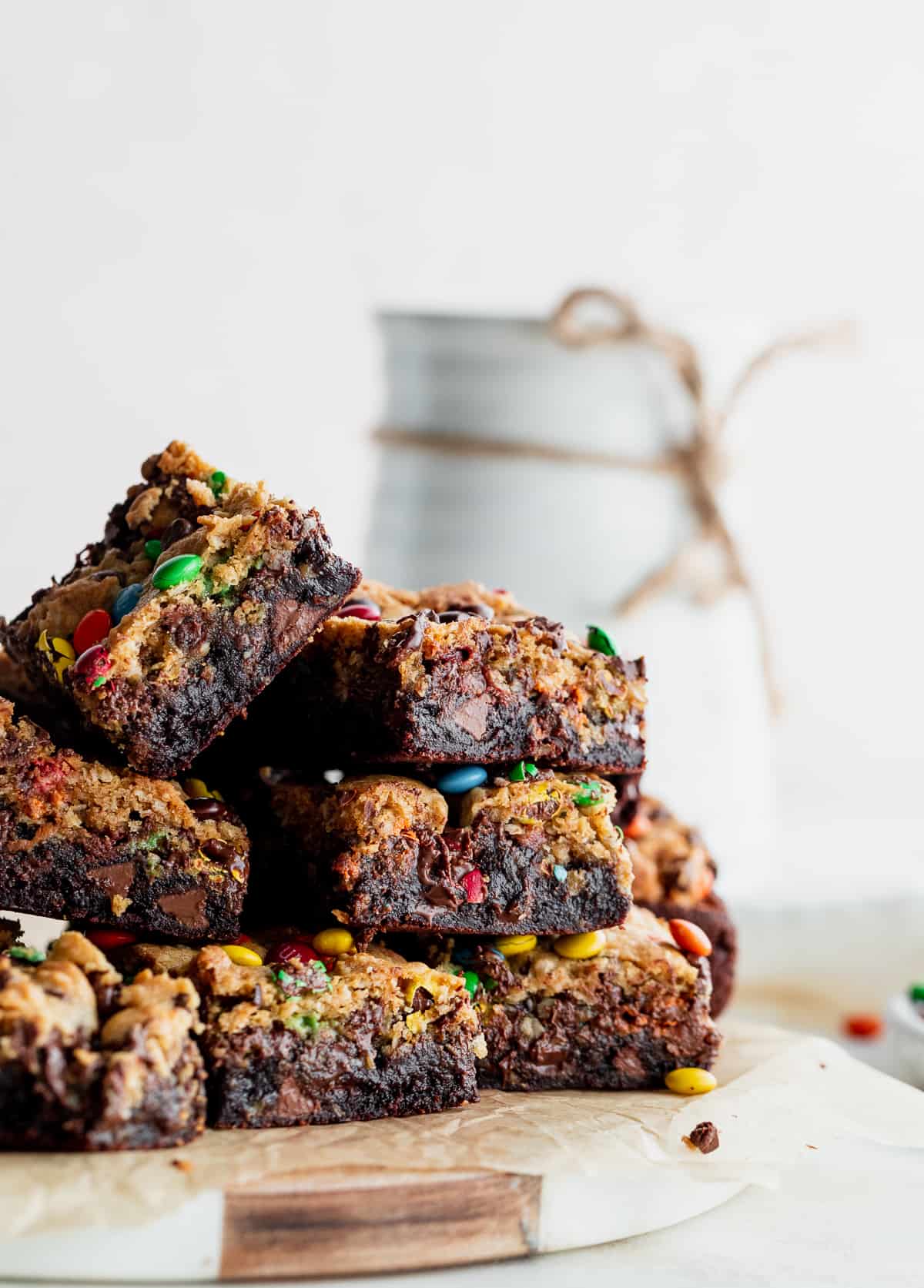 Stack of monster cookie fudgy brownies on a platter.