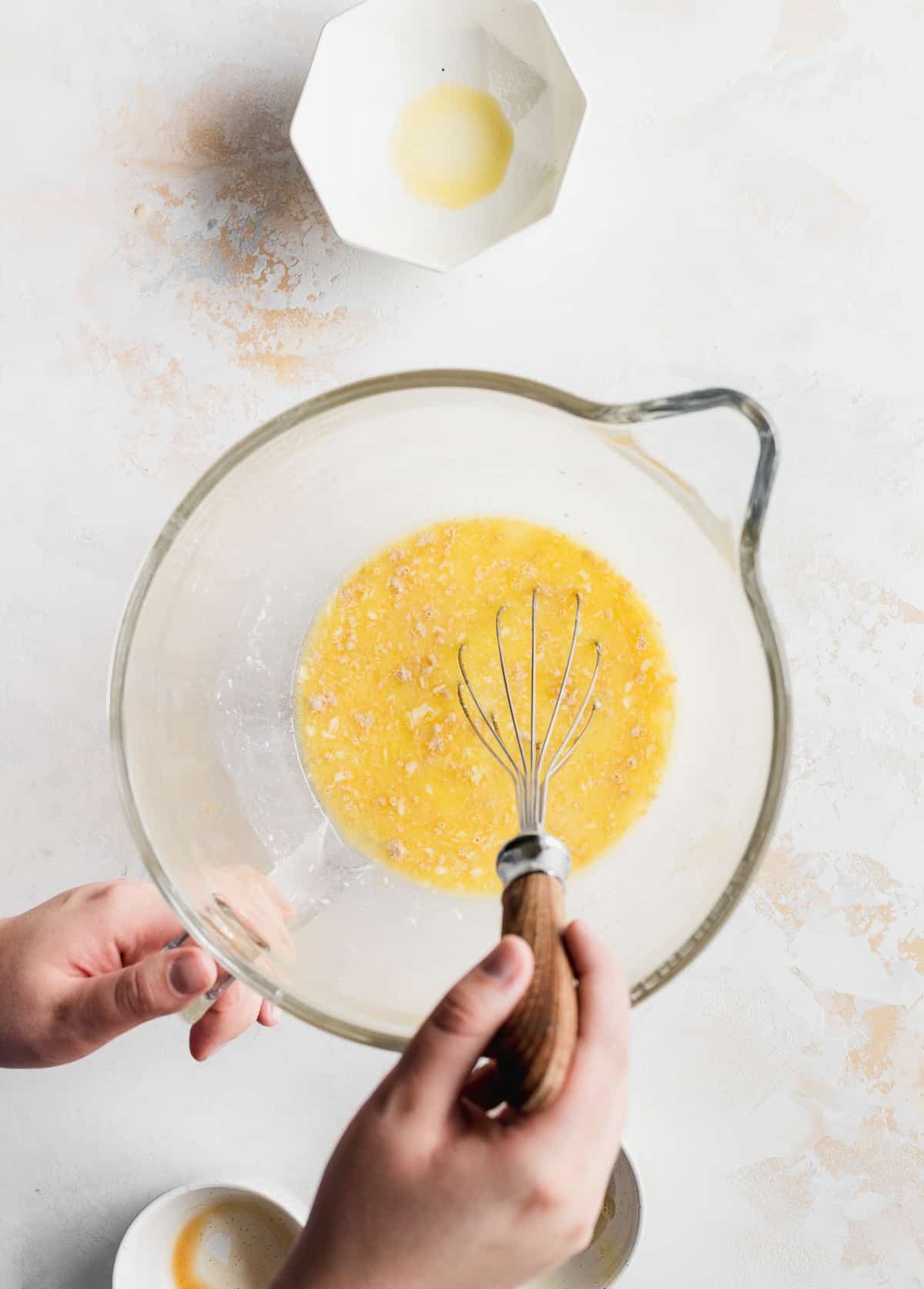 Stirring wet ingredients in bowl.