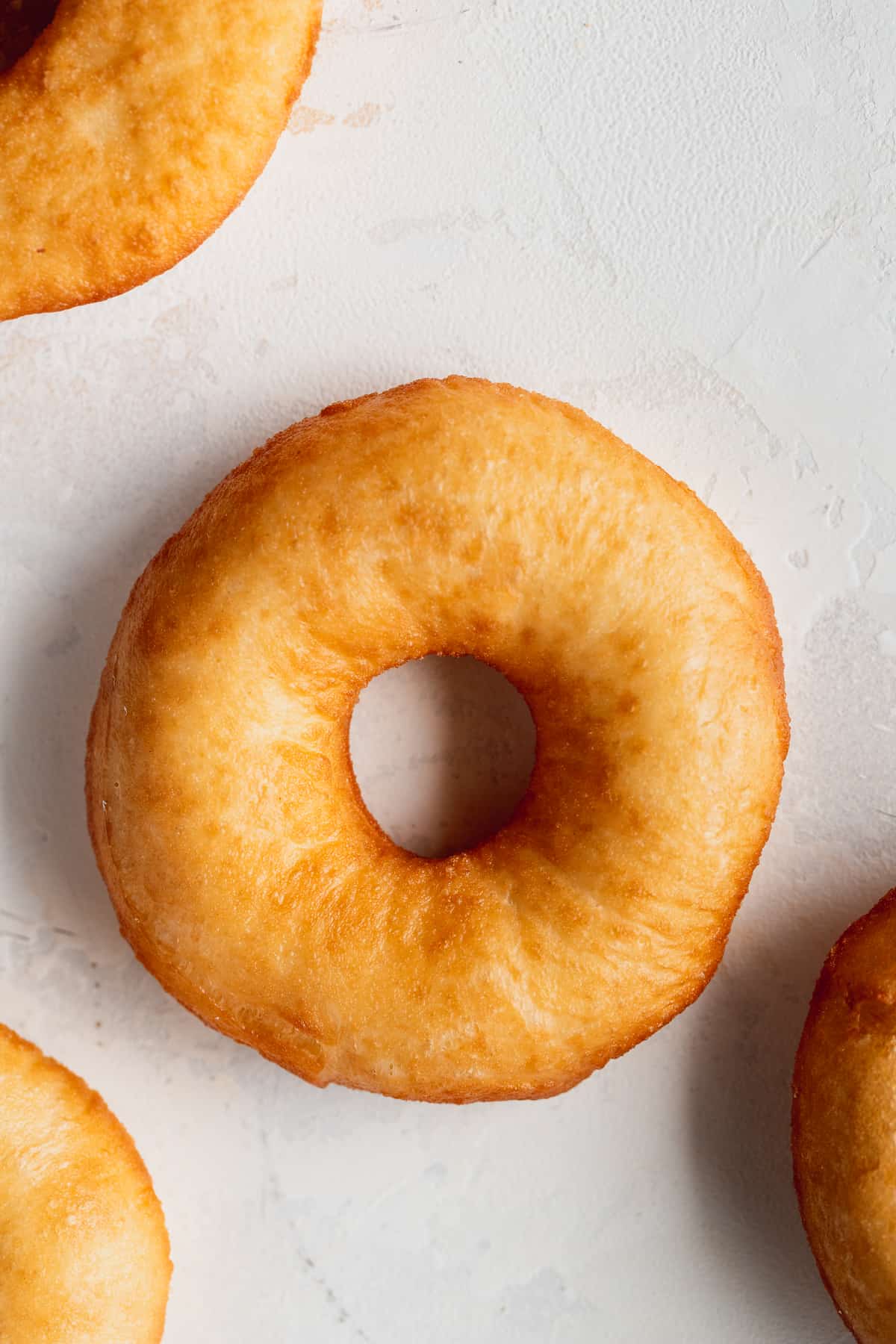 Fried doughnut with other around it.