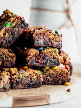 Stack of monster cookie brownie bars.